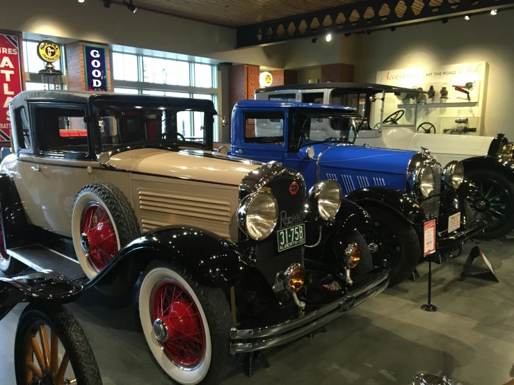 a row of antique cars on display in a museum, by Carey Morris, ballard, reddit post, akihiko yoshida”, golden 1 9 2 0 s