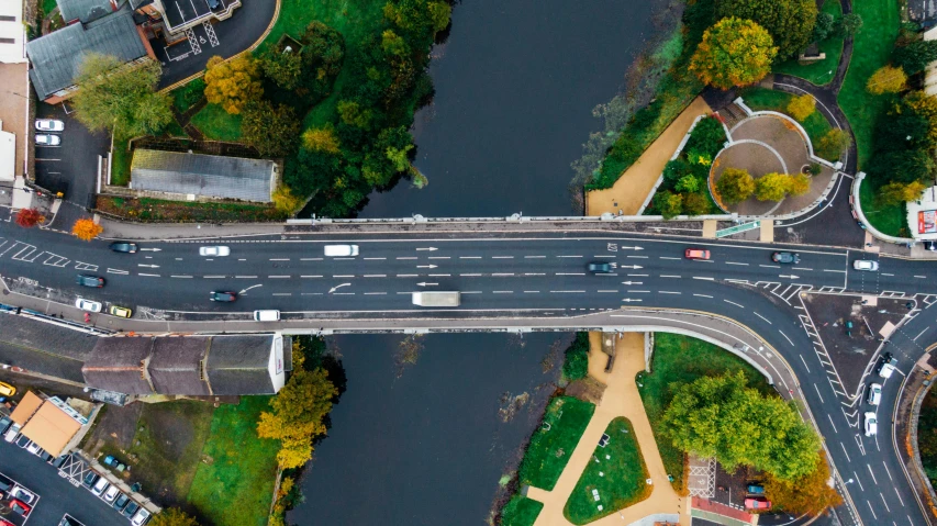 an aerial view of a bridge over a river, by Adam Marczyński, pexels contest winner, realism, floating cars, thumbnail, hyperdetailed!, street top view