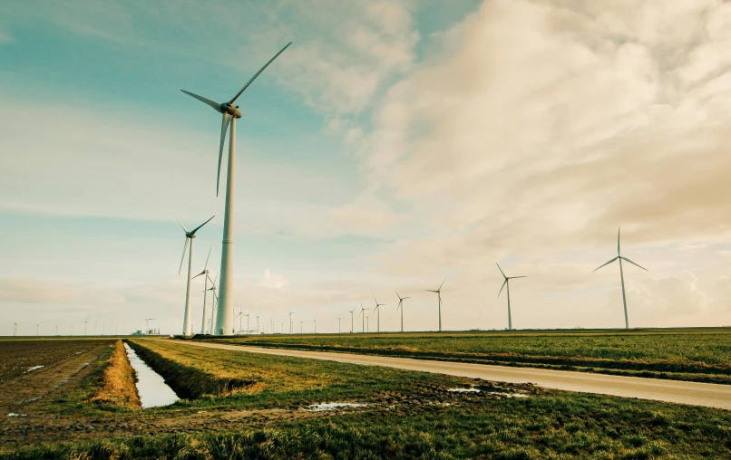 a group of wind turbines sitting on top of a lush green field, by Jan Tengnagel, pexels contest winner, epic scale ultrawide angle, retro vibe, thumbnail, 15081959 21121991 01012000 4k