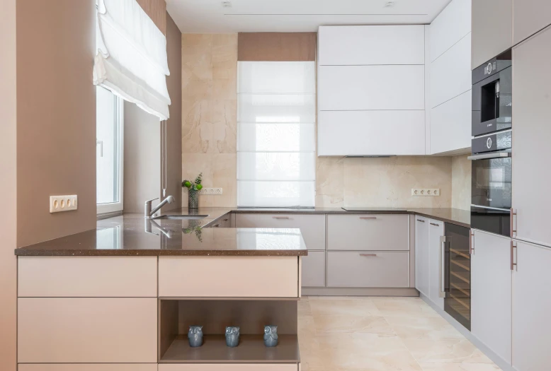 the kitchen is clean and ready for us to use, a picture, unsplash, light and space, beige colors, architectural photo, flat - color, anna nikonova