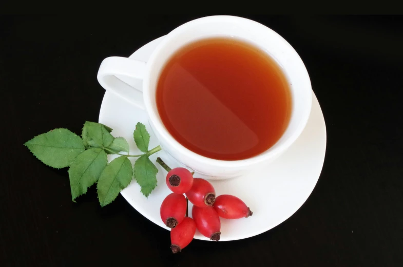 a cup of tea sitting on top of a saucer, wild berries, profile image, rose twining, drinking cough syrup