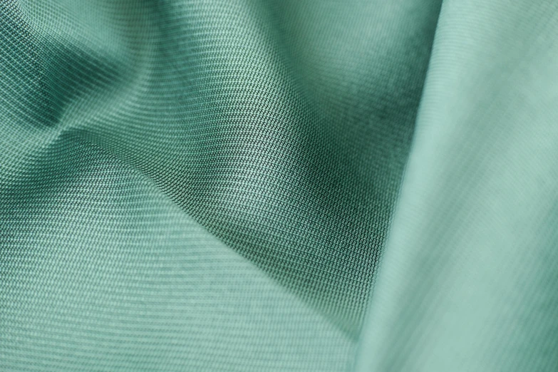 a close up of a green fabric, pastel blue, 8 k smooth, less detailing, forest green