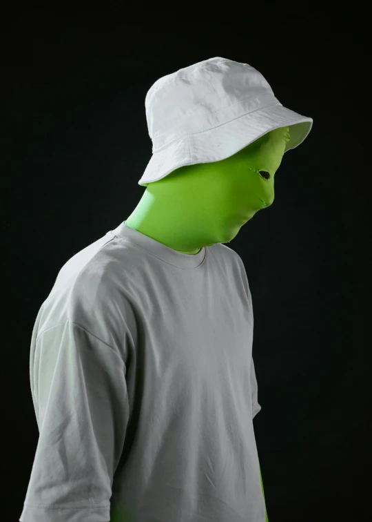 a man with a green face wearing a white hat, an album cover, inspired by Choi Buk, pexels, leaked photo, ap news photo, faceless people, lime