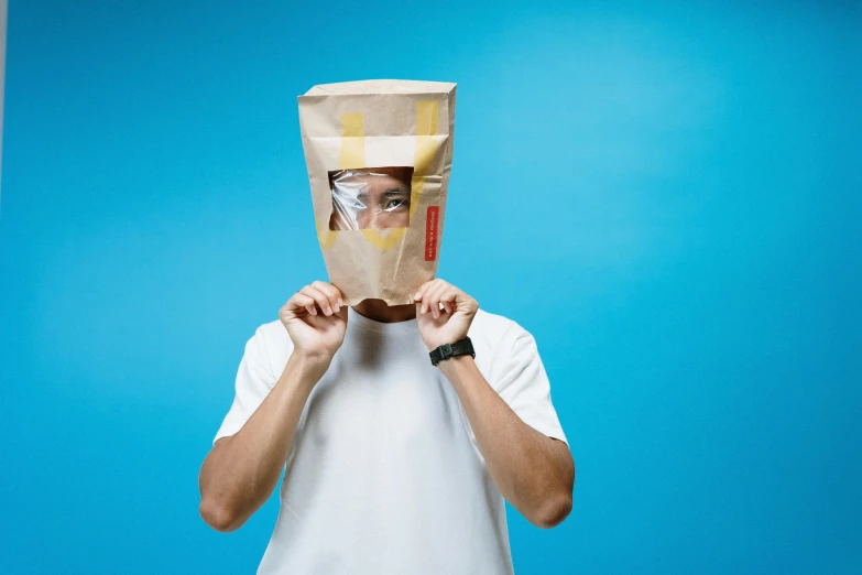 a man with a paper bag on his head, pexels contest winner, conceptual art, wearing transparent glass mask, avatar image, ad image, urine collection bag