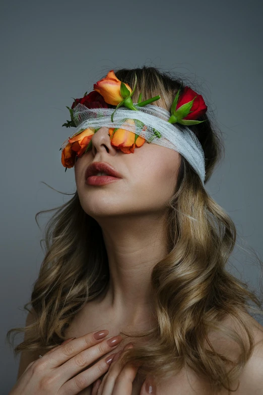 a woman with a flower crown on her head, an album cover, inspired by Elsa Bleda, trending on pexels, aestheticism, blindfold, young woman looking up, sydney sweeney, orange halo