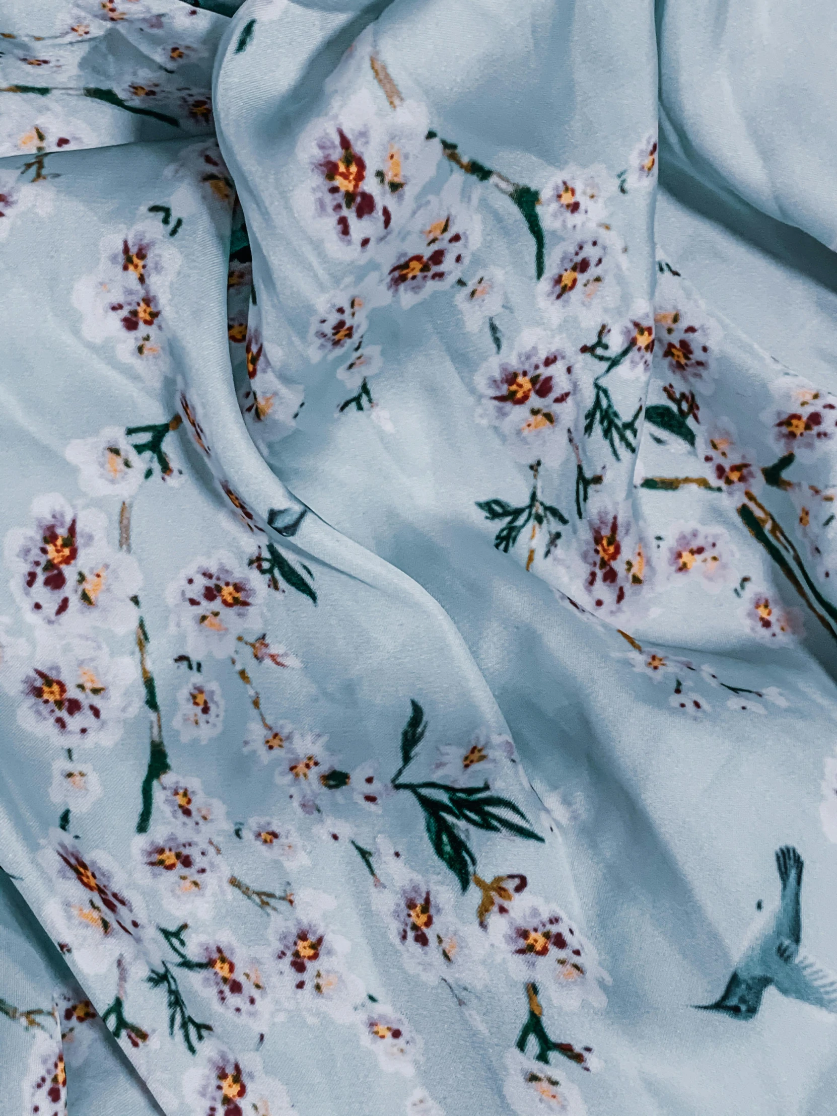 a close up of a fabric with flowers on it, inspired by Elsa Bleda, trending on unsplash, renaissance, pale blue outfit, chiffon, full product shot, detailed product image