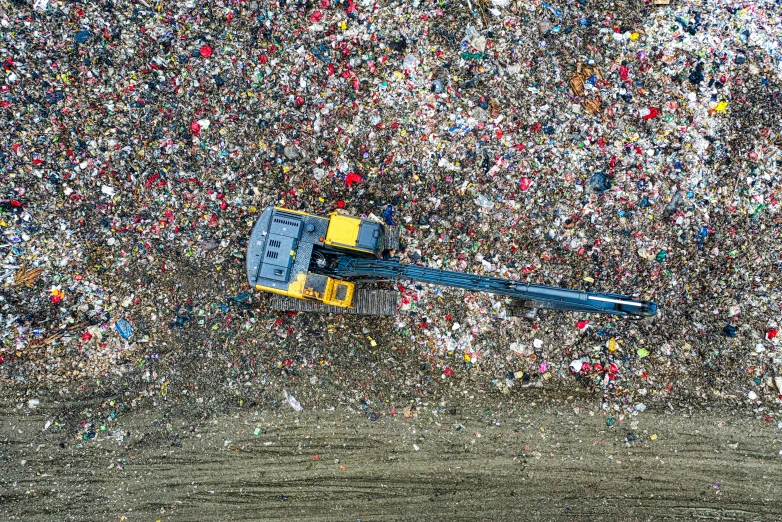 a large pile of garbage sitting on top of a dirt field, flatlay, waste processing machinery, ffffound, profile image