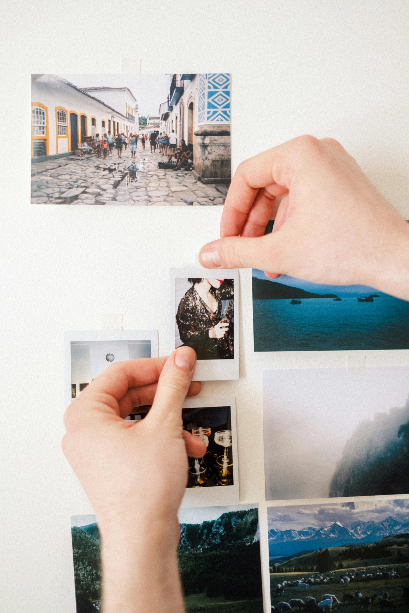 a person holding a piece of paper with pictures on it, colour polaroid photo, visually crisp & clear, on high-quality paper, iconic scene