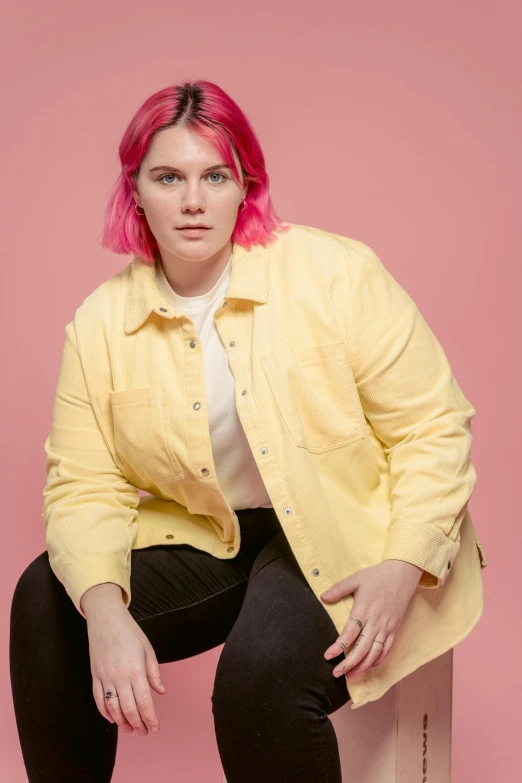 a woman with pink hair sitting on a box, trending on pexels, yellow walls, an overweight, jean jacket, style of seb mckinnon