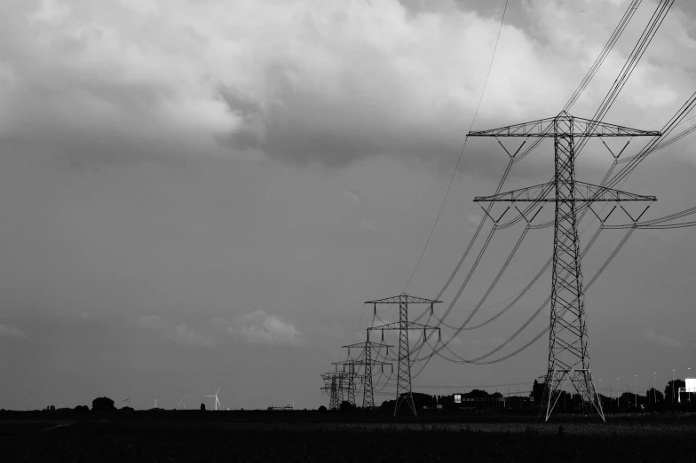 a black and white photo of power lines, a black and white photo, pexels, dark towering clouds, various posed, photographic print, blank