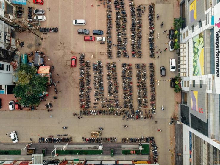 a parking lot filled with lots of parked cars, an album cover, by Matija Jama, pexels contest winner, vietnam, crowds of people praying, drones, dezeen