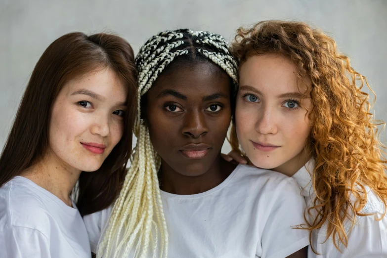 three beautiful young women standing next to each other, trending on unsplash, renaissance, brown eyes and white skin, black teenage girl, dressed in a white t-shirt, coloured