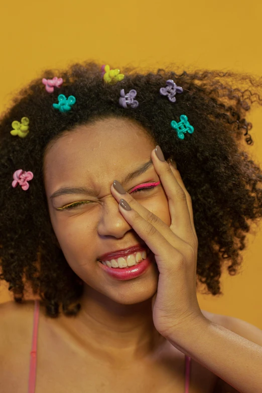 a woman with curly hair covering her eyes, trending on pexels, renaissance, brightly colored, facepalm, black teenage girl, winking