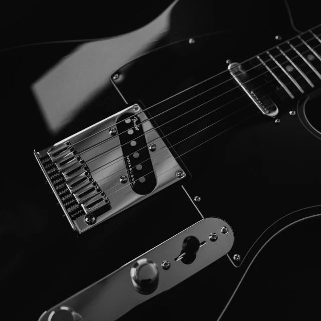 a black and white photo of a guitar, by Adam Marczyński, pexels contest winner, glossy surface, [ metal ], the color black, rectangle