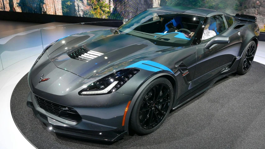 a gray sports car on display in a showroom, by Carey Morris, black and blue, ap news, banshee, gm