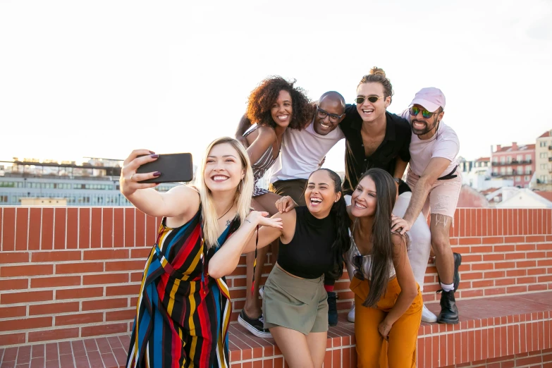 a group of friends taking a selfie together, trending on pexels, happening, rooftop, avatar image, photoshoot for skincare brand, background image