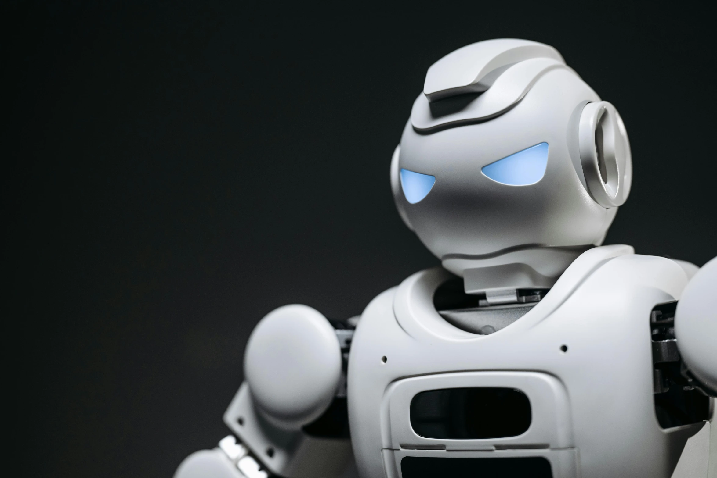 a close up of a robot on a black background, a computer rendering, featured on reddit, on a gray background, pepper, argos, complete figure