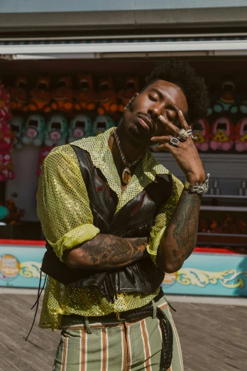 a man standing on a boardwalk smoking a cigarette, an album cover, trending on pexels, playboi carti portrait, vests and corsets, paisley, jukebox