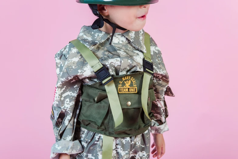 a little boy dressed up as a soldier, inspired by Henry Tonks, unsplash, dau-al-set, pink body harness, pokemon military drill, childrens toy, official product photo