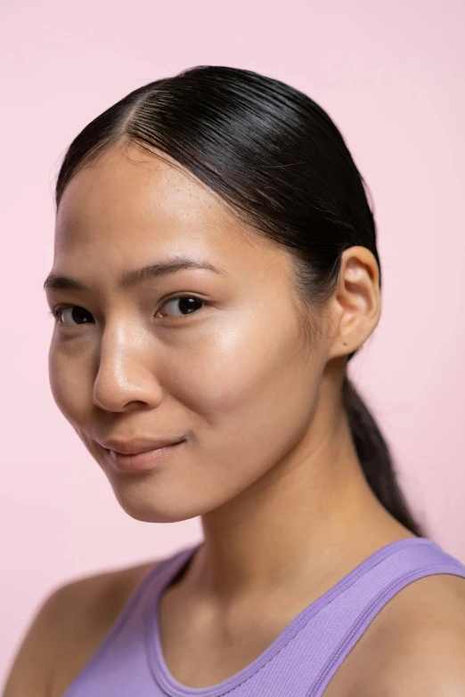 a close up of a person holding a cell phone, a character portrait, by helen huang, trending on pexels, photorealism, defined cheekbones, south east asian with round face, beauty campaign, face muscles