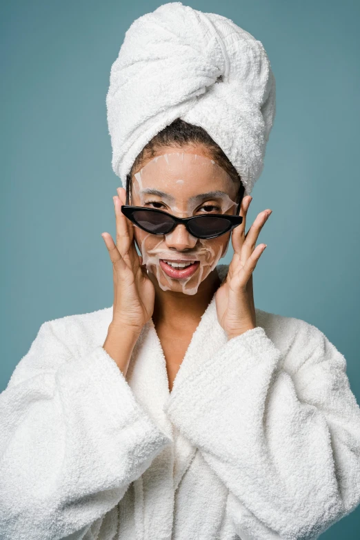 a woman with a towel wrapped around her head, trending on pexels, renaissance, wearing glack glasses, asian face, silicone skin, amused