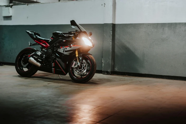 a motorcycle parked in a garage next to a wall, pexels contest winner, soft lighting 8k, fan favorite, side lights, profile image