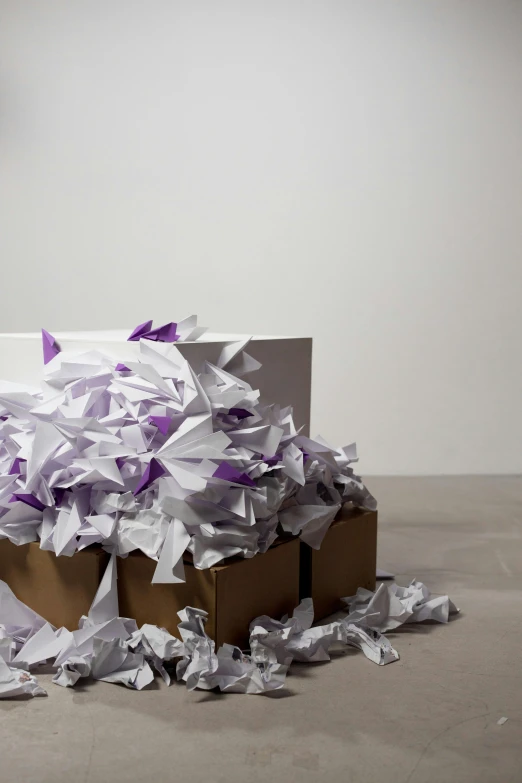 a pile of shredded paper sitting on top of a table, an abstract sculpture, by artist, pexels contest winner, box, purple ribbons, upset, on white paper