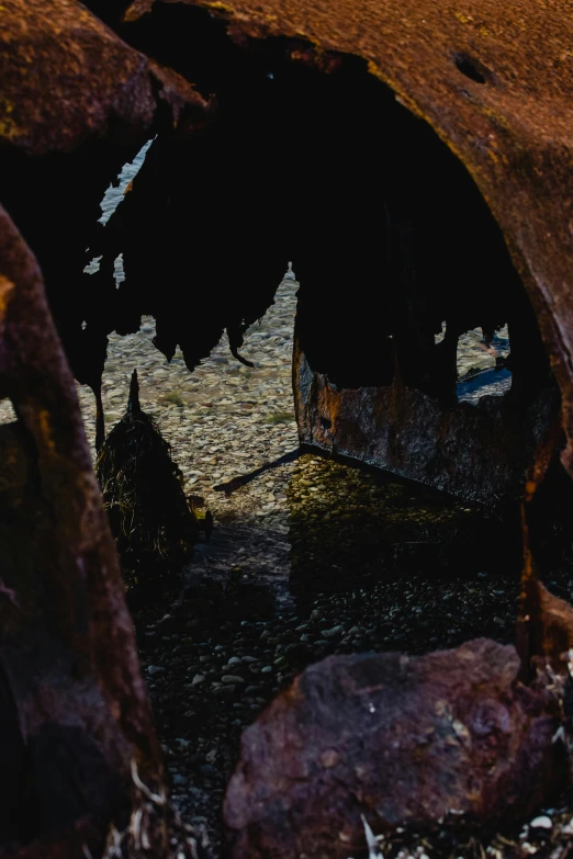 an old rusted truck sitting on the side of the road, an album cover, pexels contest winner, auto-destructive art, photo of a camp fire underwater, abstract detail, inside of an expansive cave, made of tar