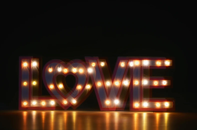 a lit up love sign sitting on top of a table, retro lights, image, brown, commercial