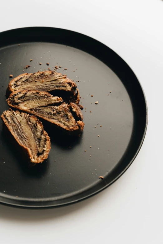 a close up of a plate of food on a table, a digital rendering, unsplash, hurufiyya, cicada wings, made of tar, pastry, high quality product image”