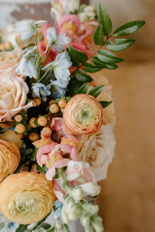 a bouquet of flowers sitting on top of a table, by Kristin Nelson, up close shot, tufted softly, rich pastel colors, intricate details. front on