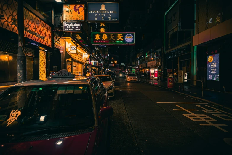 a city street filled with lots of traffic at night, inspired by Liam Wong, pexels contest winner, hyperrealism, chinatown bar, cyberpunk signs, unsplash photo contest winner, cars parked