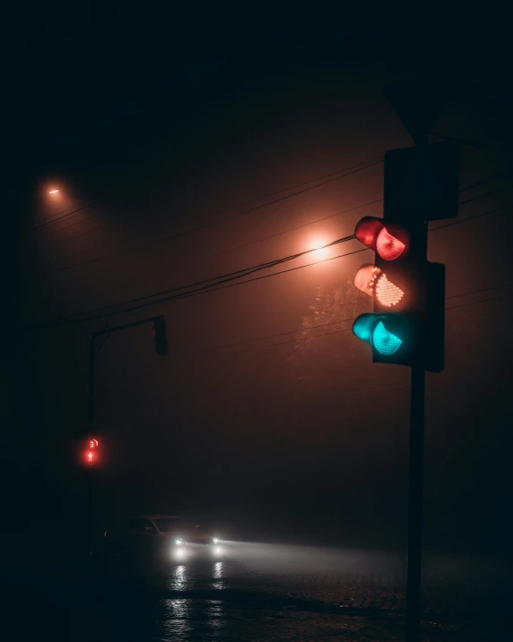 a traffic light sitting on the side of a road, by Adam Marczyński, unsplash contest winner, foggy volumetric lighting, gloomy colors, muted neon colors, instagram picture