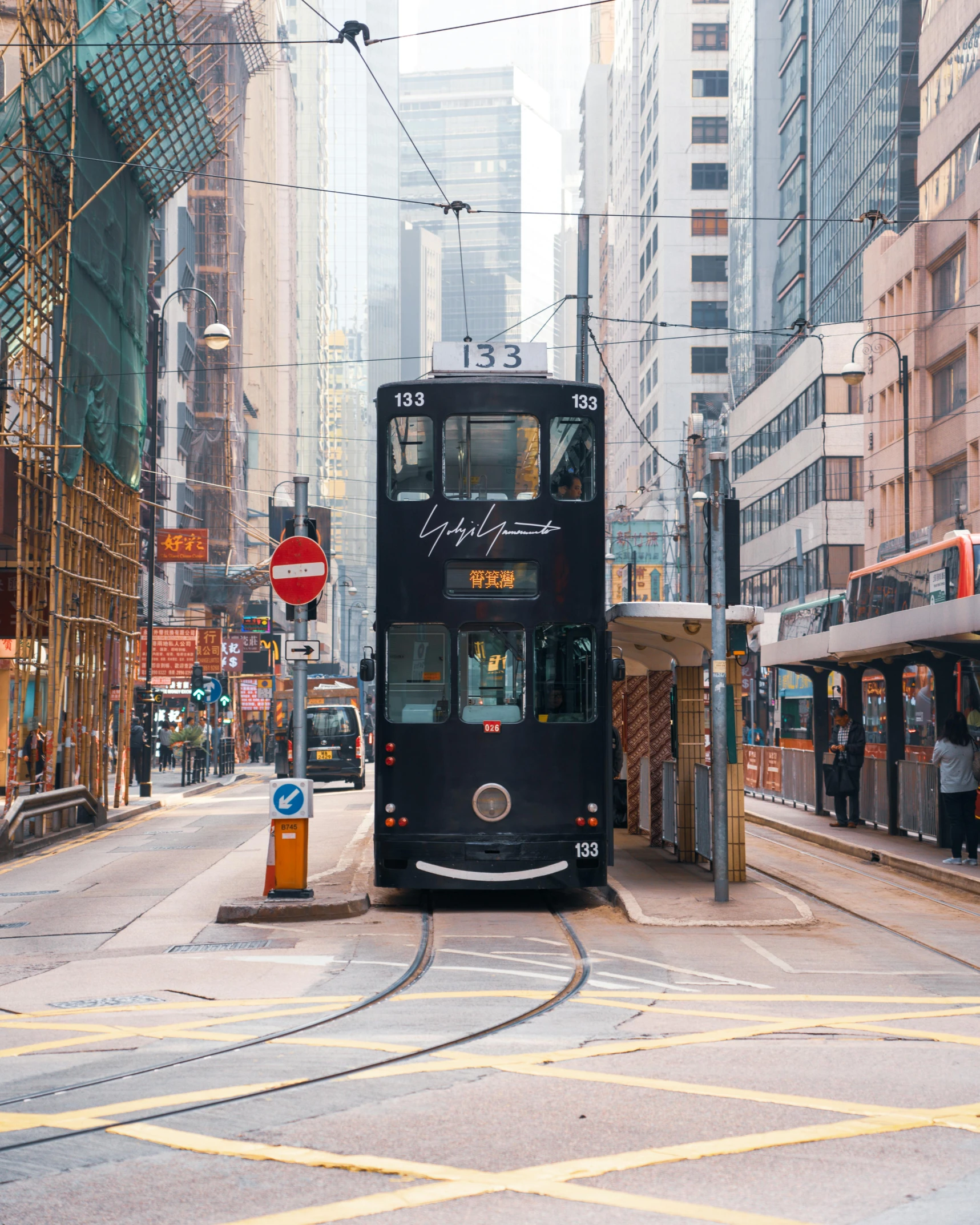 a double decker bus on a city street, by Adam Rex, pexels contest winner, hyperrealism, city like hong kong, lgbtq, tram, 🚿🗝📝