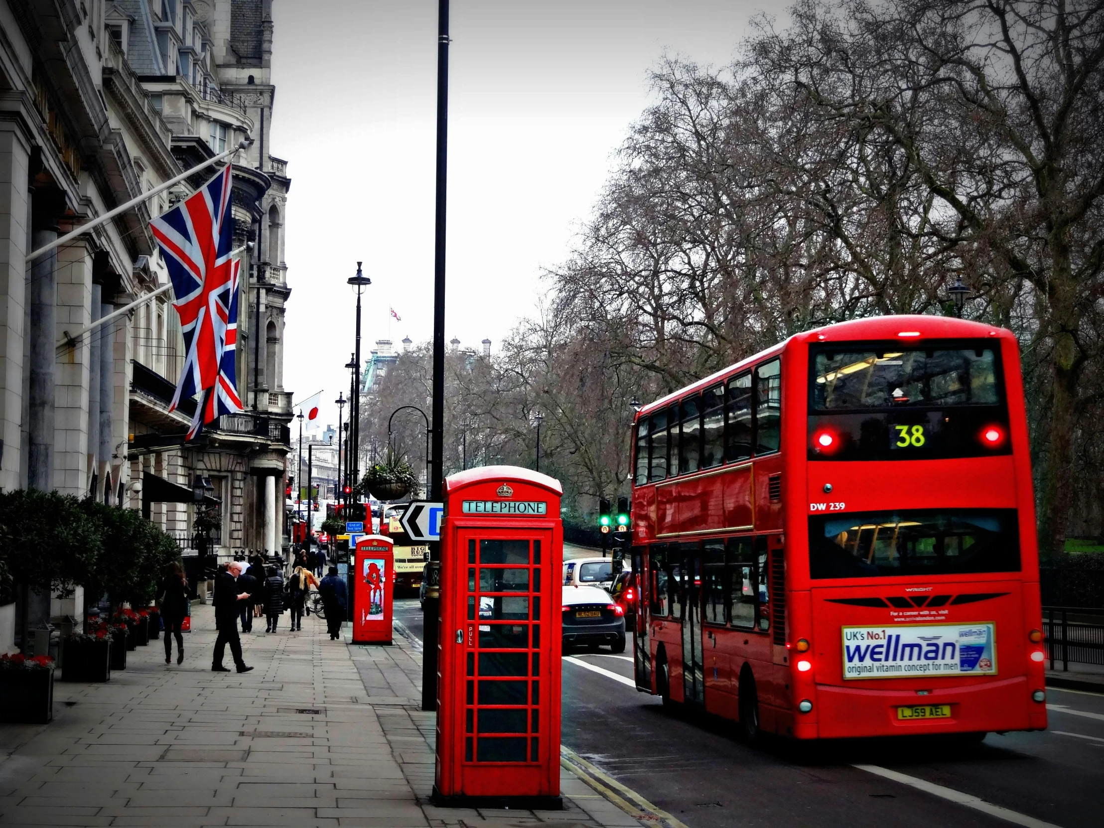 a red double decker bus driving down a street, by David Donaldson, pexels contest winner, visual art, union jack, islamic, square, by greg rutkowski