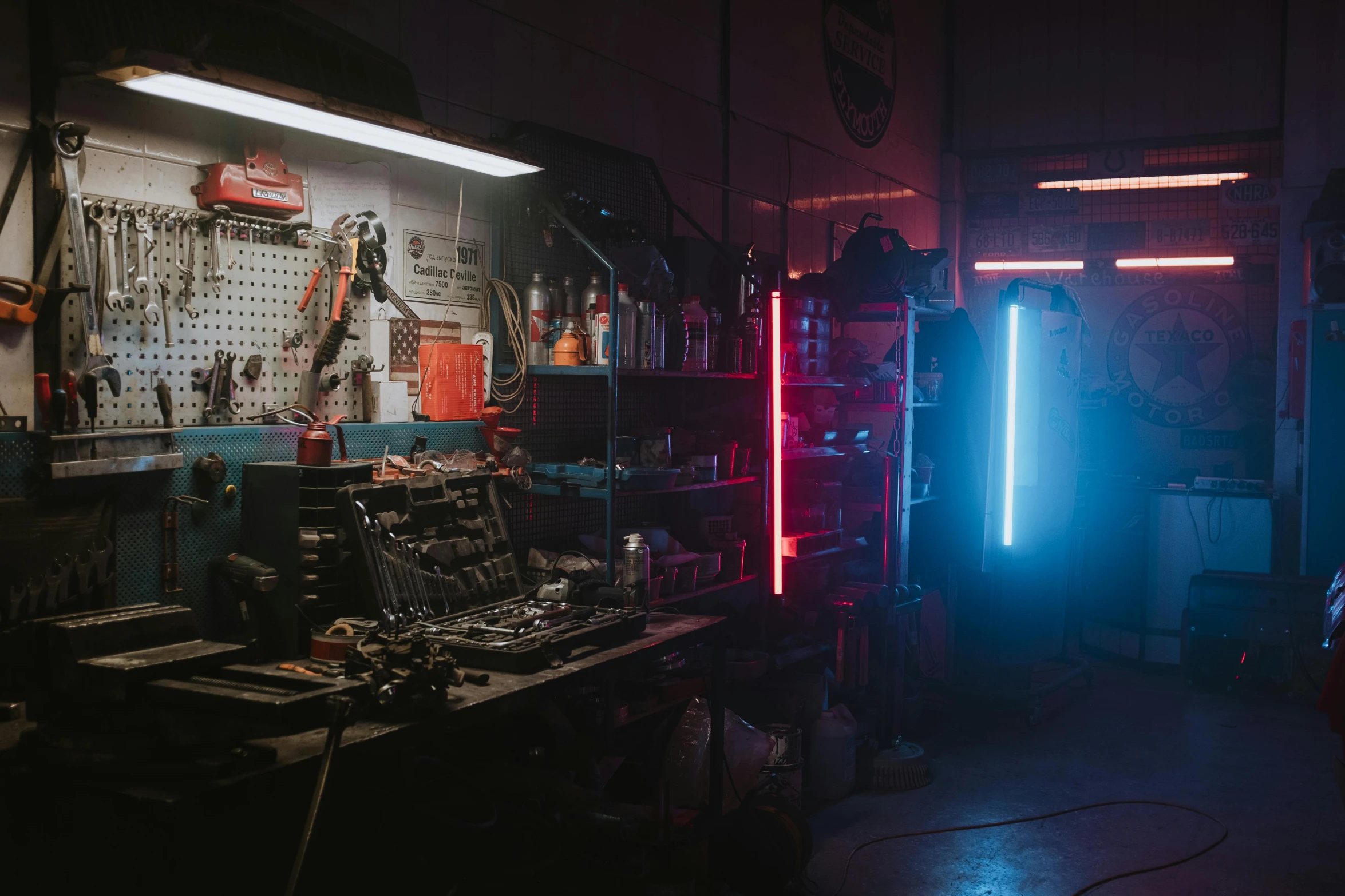 a garage filled with lots of tools and lights, cyberpunk art, inspired by Elsa Bleda, neon fog, cinematic counter light, red and blue neon, commercial lighting