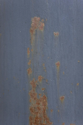 a red fire hydrant sitting in front of a blue wall, by Rudolf Schlichter, skin grain detail, (rust), blue gray, oil on aged tin