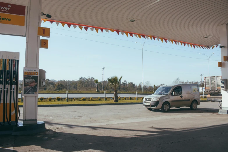 a van is parked at a gas station, by Alejandro Obregón, 000 — википедия, enes dirig, gulf, nikolay georgiev