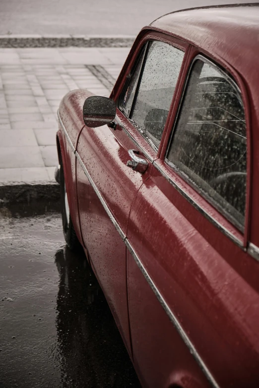 a red car parked on the side of the road, pexels contest winner, photorealism, hard rain, square, soviet nostalgia, foam