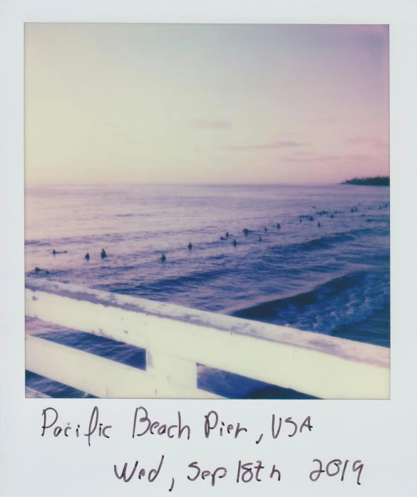 a polaroid photo of people swimming in the ocean, private press, long beach background, pog, 1/30, purple - tinted