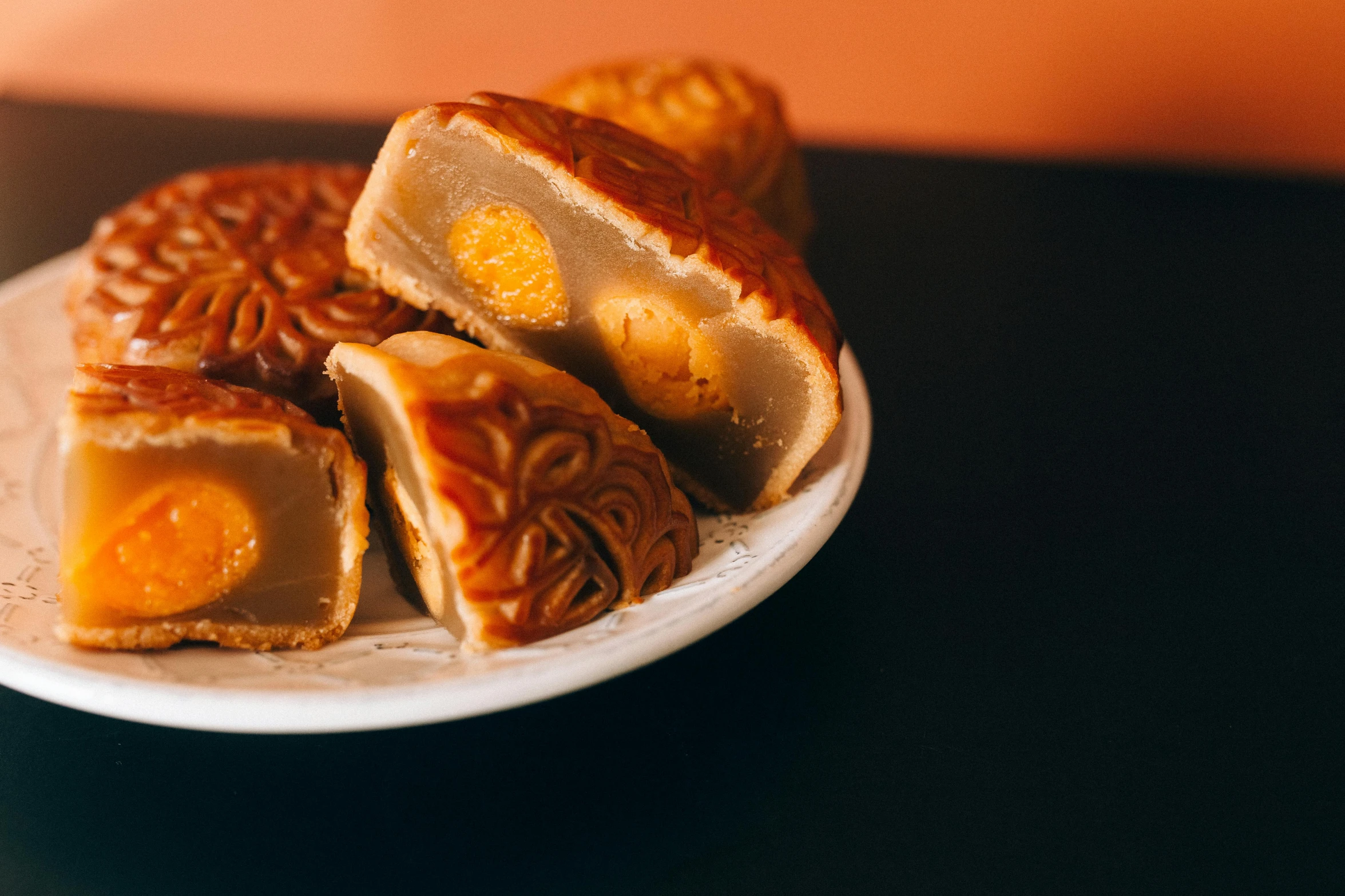 a close up of a plate of food on a table, floating chinese lampoons, caramel, 王琛, premium