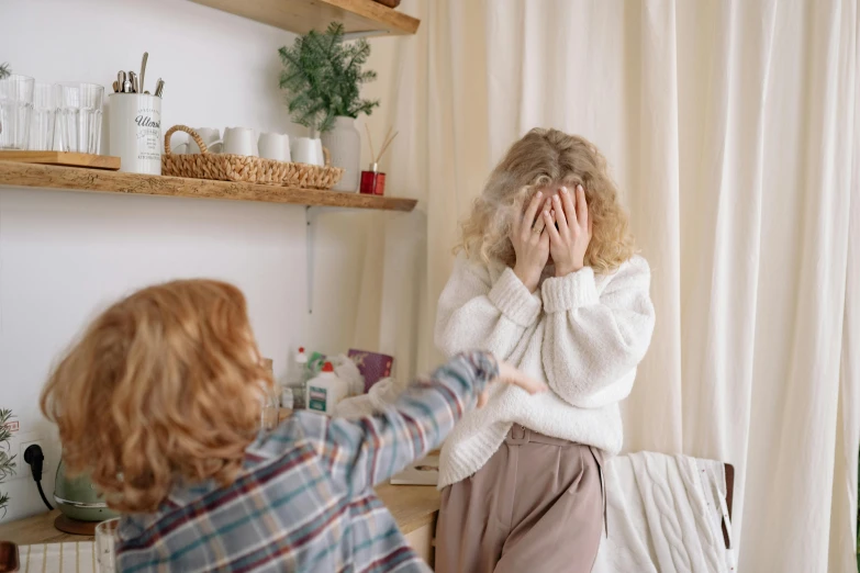 a little girl covering her face with her hands, trending on pexels, happening, woman holding another woman, messy bedroom, drunk woman, gif