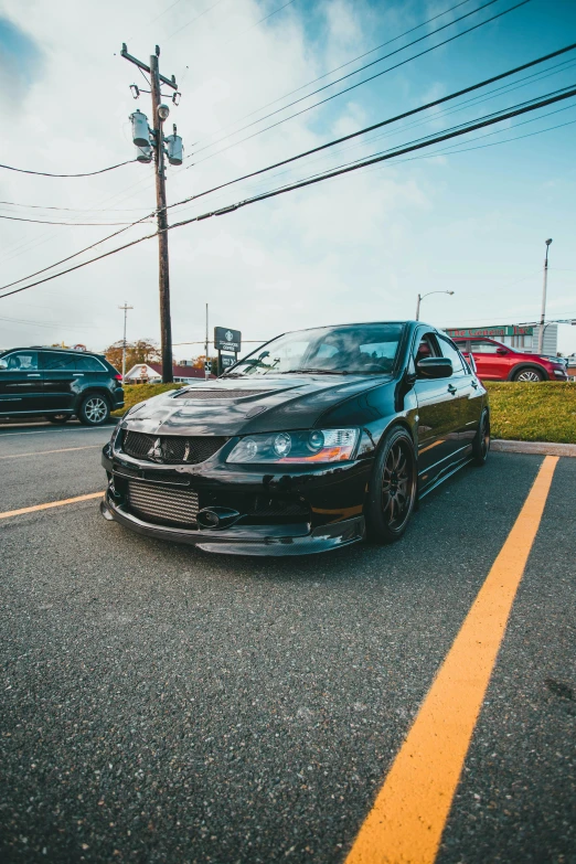 a black car parked in a parking lot, jdm, taken in 2 0 2 0, profile picture 1024px, late 2000’s