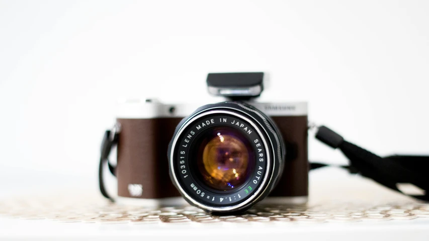 a camera sitting on top of a table, by Yasushi Sugiyama, unsplash, photorealism, on hasselblaad, japanese, ecommerce photograph, aperture f 3. 2