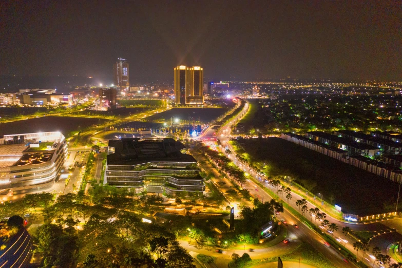 an aerial view of a city at night, pexels contest winner, vietnam, karachi skyline background, parks and public space, transparent background