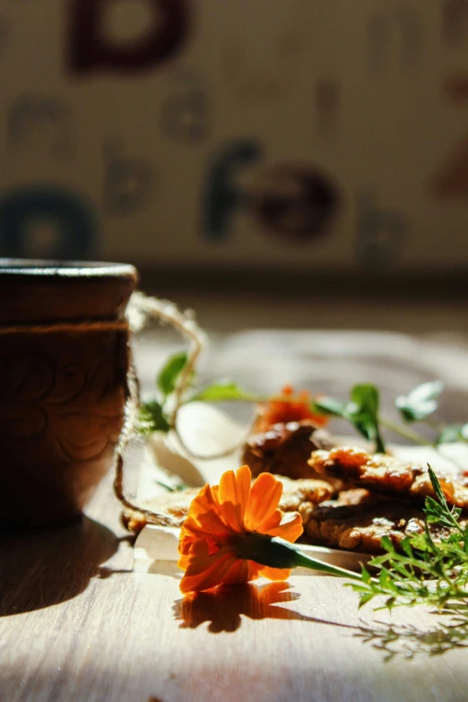 a wooden bowl sitting on top of a wooden table, a still life, by Zofia Stryjenska, unsplash, renaissance, marigold flowers, breakfast, with backlight, ((portrait))
