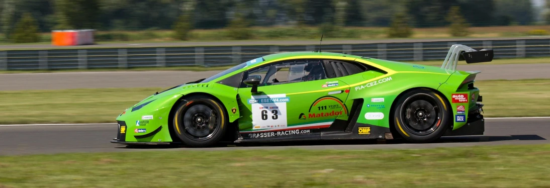 a green sports car driving on a race track, a photo, by Jan Tengnagel, renaissance, lamborghini, highly detailed in 4 k ”, maxxis, podium