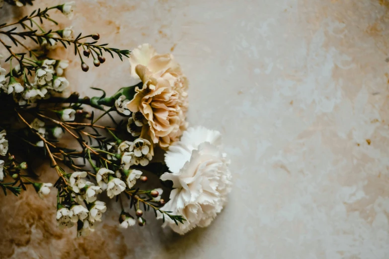 a bunch of flowers sitting on top of a table, by Carey Morris, trending on unsplash, romanticism, ivory and black marble, carnation, manuka, muted browns