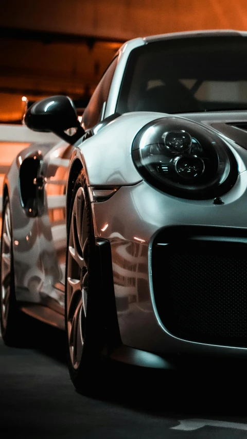 a silver sports car parked in a parking lot, pexels contest winner, superb detail 8 k, gun metal grey, thumbnail, dramatic lighting - n 9