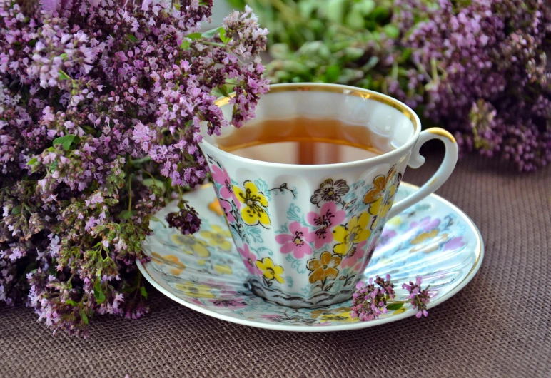 a cup of tea next to a bunch of flowers, by Zofia Stryjenska, pixabay, lilac bushes, avatar image, square, multicoloured